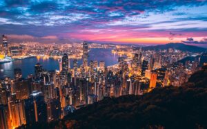 A photo of the vibrant Hong Kong city skyline at twilight
