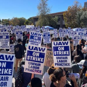 TAs at UCSB on strike, holding signs "UAW on Strike, Unfair Labor Practice"